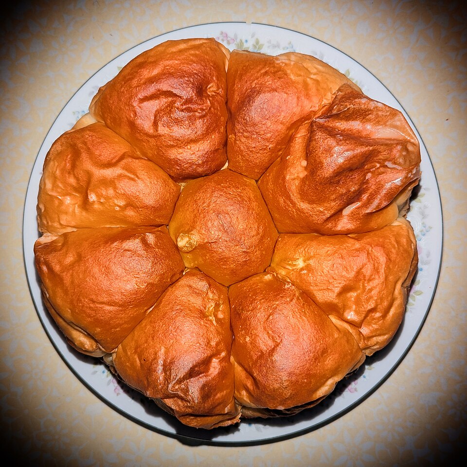 An illustrative milk-bun base before curry filling